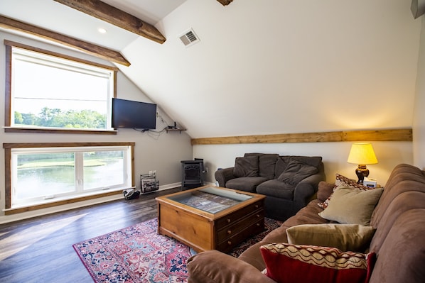 Living room space, with gas fire place and DirecTV.  