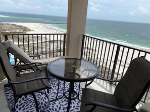 Relax on your private balcony with mesmerizing views of Orange Beach.