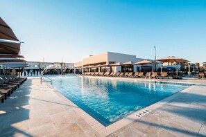 Swimming pool with loungers and umbrellas