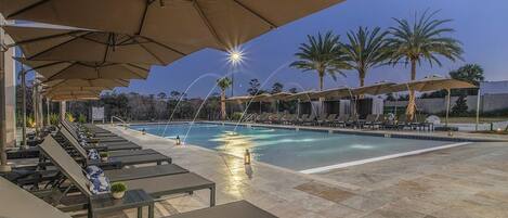 Swimming pool with loungers and umbrellas