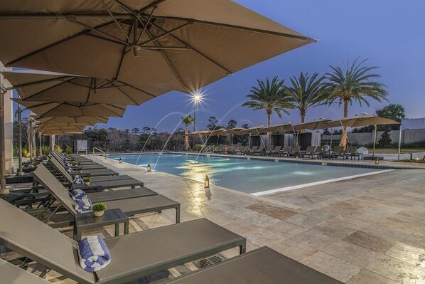 Swimming pool with loungers and umbrellas