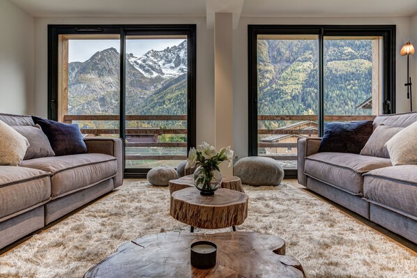 Living room with floor to ceiling windows