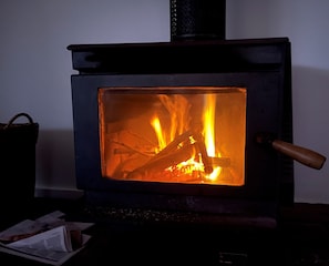 Cozy wood fire with complimentary firewood