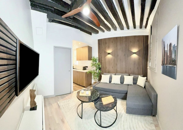 Cosy living room with large convertible sofa bed, perfect for watching TV