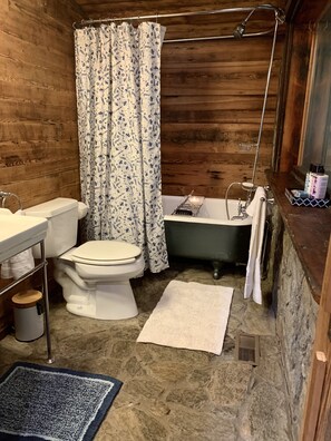 Bath with original clawfoot tub and shower combo