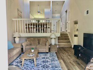 Downstairs view to dining room.  Primary bedroom same level as living room.