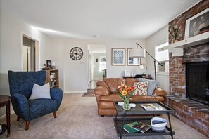 Living Room:Hallway w/ 2 bedrooms & bathroom on the left. Kitchen/Dining in back