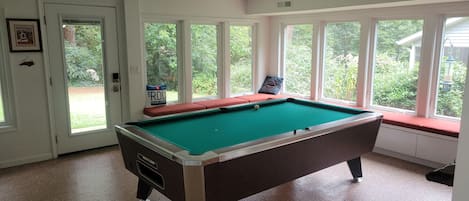 Gameroom featuring free pool with automatic ball return.  There are no curtains.