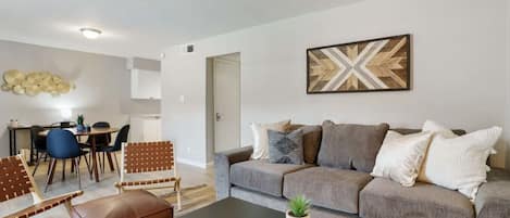 Living room with large sleeper sofa and smart tv
