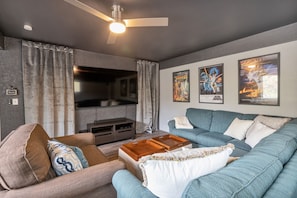 The home theater/cinema offers an 82" inch TV with surround sound.