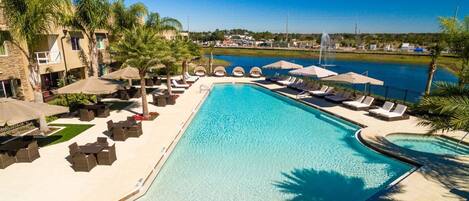 Large swimming pool with loungers and umbrellas