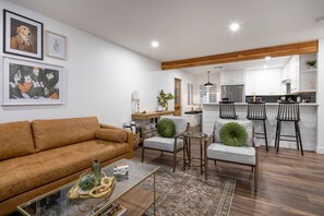 Main living space.  View from living room into kitchen/dining area. 