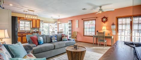 Bask in the radiant natural light that fills both the kitchen and living room, creating a warm and inviting atmosphere.