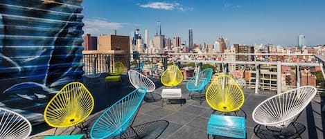 With a 1,000 square-foot roof deck exposing three magnificent views of Manhattan!