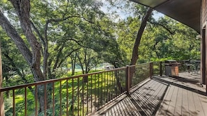 Deck with beautiful views of the lake and a grove of pecan trees.