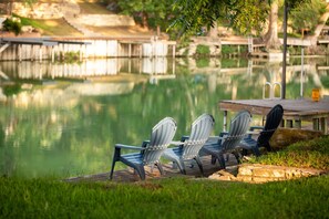 Relax lakeside. Private dock and serene water views await you.