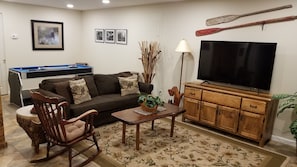 Main seating area, queen size sofa bed for extra guests. 58" Roku TV.