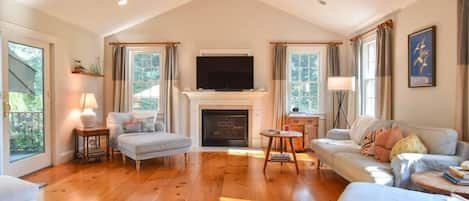 The living room with direct access to the deck and private backyard.