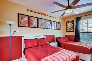 Enjoy 2 cozy full-size beds in our charming Mickey-themed room