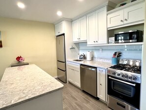 Plenty of kitchen appliances including dishwasher and light dimmers