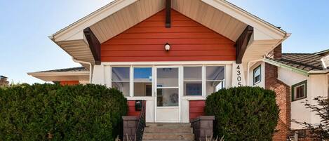 Front Door leads to porch, then main entrance. 