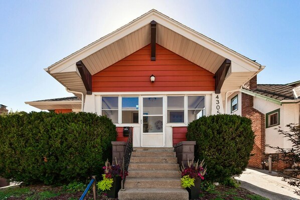 Front Door leads to porch, then main entrance. 