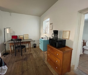 Desk/ mini fridge/ microwave / coffee pot