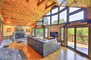 Living Room | High Ceilings & Natural Light | Wood-Burning Fireplace