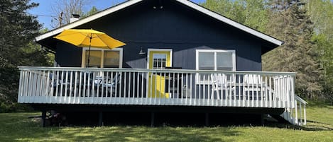 Front view of house, with a large yard to relax and play!