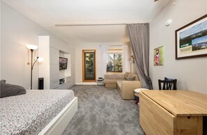 Queen bed, pull out couch, breakfast/dinner table that extends