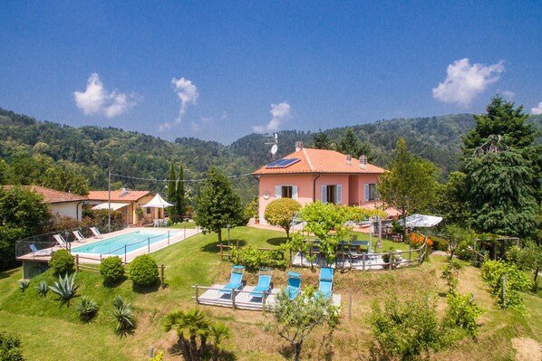The property, the pool and the private garden surrounding