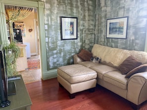 Head back through the kitchen to the living room -- the perfect place for you and your guests to unwind.