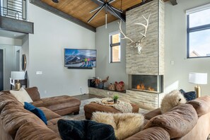 Warm up by the fire or settle in on the oversized couch for movie night