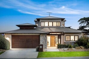 Indulge in luxury at a retreat with stunning golf course frontage on the prestigious 13th Beach Golf Links
