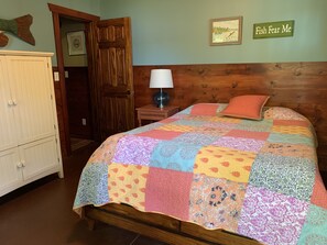 One of the main floor bedrooms with its own access to deck