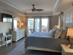 Master bedroom with doors to the patio