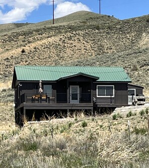 Exterior of home from end of driveway. Lots of open space and great views.
