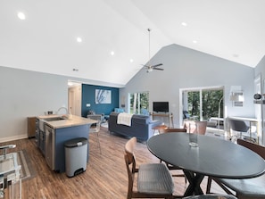 Modern and open-concept dining, living, and kitchen.