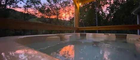 Sunsets on the covered porch hot tub is a magical combination. Overlooking the river, you can hear the flowing water from the porch while relaxing in the hot tub.