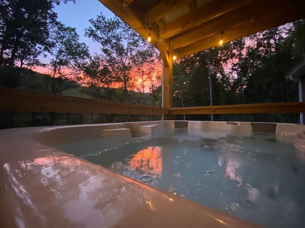 Sunsets on the covered porch hot tub is a magical combination. Overlooking the river, you can hear the flowing water from the porch while relaxing in the hot tub.