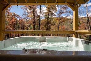 Listen to the sounds of the river while soaking in the hot tub on the covered porch. One guest said: "Wonderful base camp to explore & return to lounge on the comfy sofa on the deck as the sunsets."