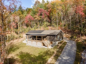 Nestled right on the line of the Pisgah National Forest, this home is a great escape from the day to day routine.  Quiet and relaxing is what you get here, and with private access to the river across the street, a calm stay here is just the beginning.