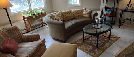 Furnished Living room, complete with Smart tv (fire stick) and DVD player.