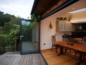 Bifolding door opens onto garden deck 