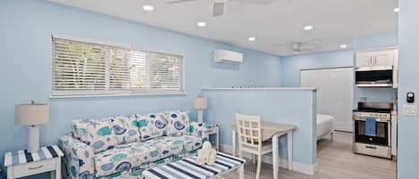 Captain Ed's Cottage- Gorgeous Residence at Palmview Inn of Sanibel featuring a king bed and queen sleeper sofa with memory foam mattress, in addition to a large bathroom with walk in shower and fully equipped kitchen