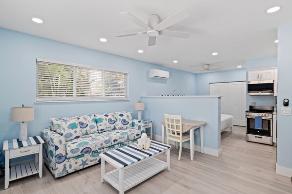 Captain Ed's Cottage- Gorgeous Residence at Palmview Inn of Sanibel featuring a king bed and queen sleeper sofa with memory foam mattress, in addition to a large bathroom with walk in shower and fully equipped kitchen