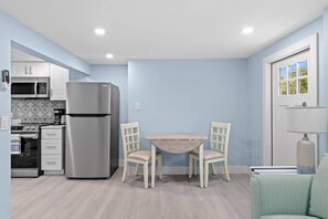 Large living room with dining table for 4 guests