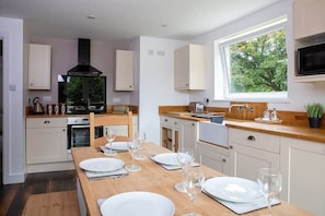 Spacious kitchen is fully equipped to provide you with an inviting space when you don't want to go to a restaurant.