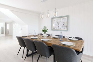 In the downstairs lounge also has a dining table with space for everyone to gather over good food and drink.