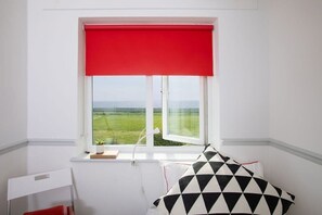 Lift the blinds for an amazing sea view.